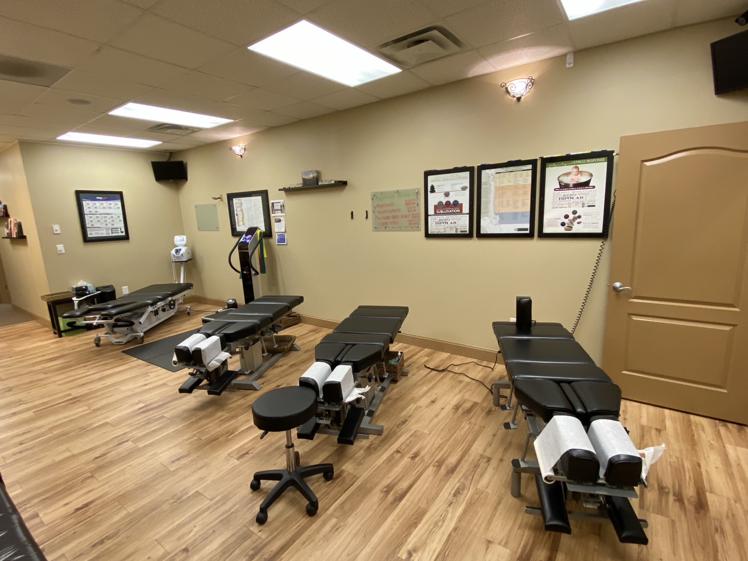 Chiropractic adjusting tables in the treatment area at Crossroads Chiropractic, Sharpsburg